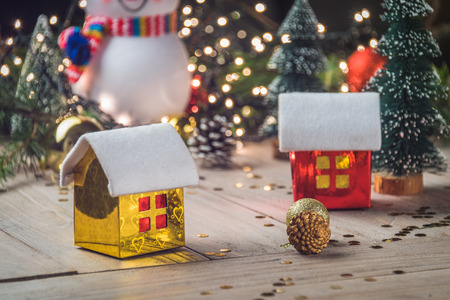 christmas decorations with baubles,tree and toy house.の写真素材