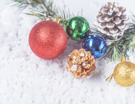 full frame of christmas ornaments on snow.の写真素材