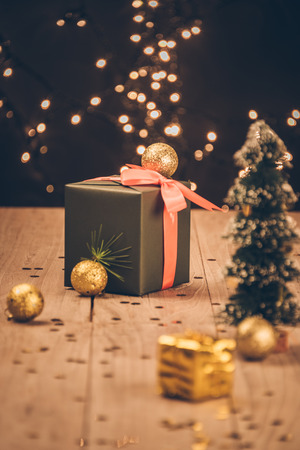christmas decorations and green present on wood.の写真素材