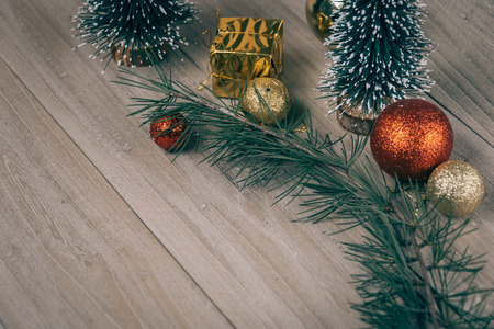 studio shot of christmas ornaments on wooden plank,retro style.の写真素材
