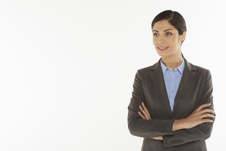Businesswoman smiling with arms crossedの写真素材