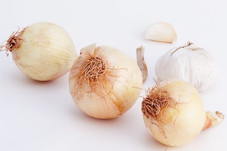 onion and garlic isolated on a white backgroundの写真素材