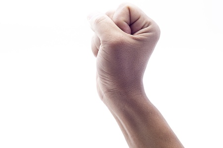 Hand showing victory with a fist,isolated on whiteの写真素材