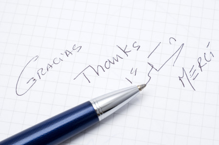 pen with the word ` ââthanks ` written in several languagesの写真素材