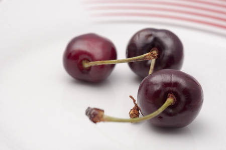 Juicy cherry close-up on white background.の写真素材