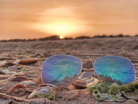 sunglasses on the beach in summer day