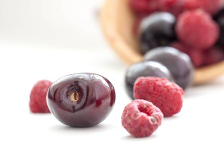 image  raspberries and grapes on white