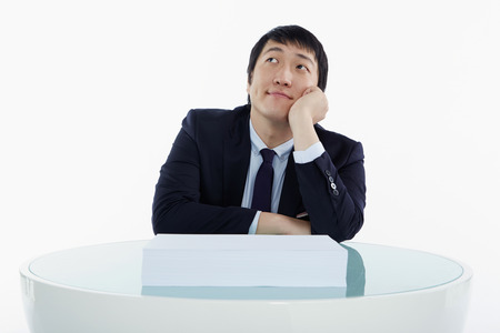 Businessman sitting and contemplatingの写真素材