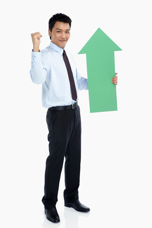 Businessman with an arrow, cheeringの写真素材