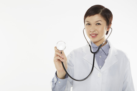 Medical personnel examining with a stethoscopeの写真素材