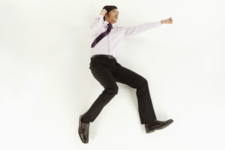 Businessman posing on the floorの写真素材