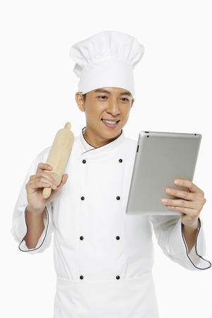 Chef using a digital tabletの写真素材