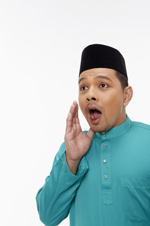 Man in traditional clothing with a surprised facial expressionの写真素材