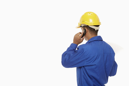 Construction worker talking on the phone