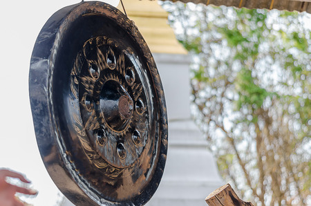 gong hanging in pavilion on blur backgroundの写真素材