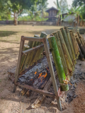 on selective focus of Glutinous Rice Grilled in Bamboo Joints,Food northeastern Thailandの写真素材
