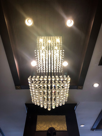 The picture is dark and soft focus of ceiling lights.の写真素材