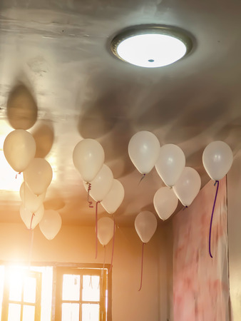 Blurred picture of The white balloon decorations A party for a group of friends.の写真素材