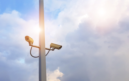CCTV camera mounted on a pole to spy on intruders from stealing.の写真素材