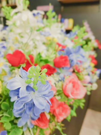 Colourful plastic flowers. For the decoration, a beautiful room.の写真素材