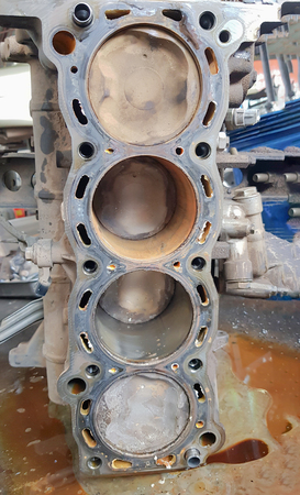 Technicians are repairing the engines of cars and spare parts.