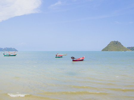 The sand and the sea. Background beautiful blue sky