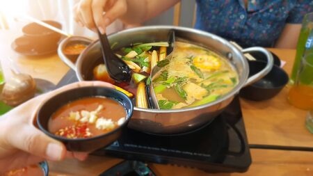 Asian family Celebrate special occasions By eating hot pot together.