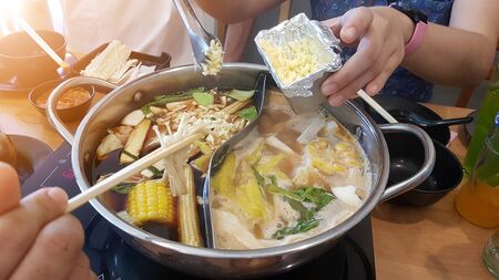Asian family Celebrate special occasions By eating hot pot together.