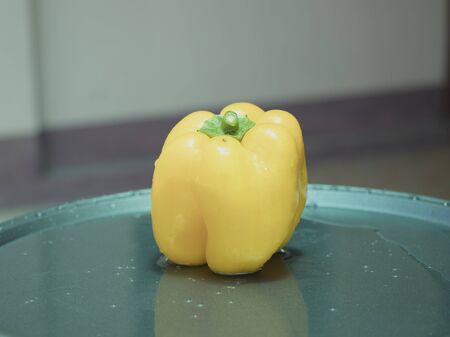 On selective focus of The chef is is washing sweet peppers with beautiful colors to cook.の写真素材