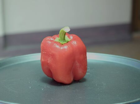 On selective focus of The chef is is washing sweet peppers with beautiful colors to cook.の写真素材