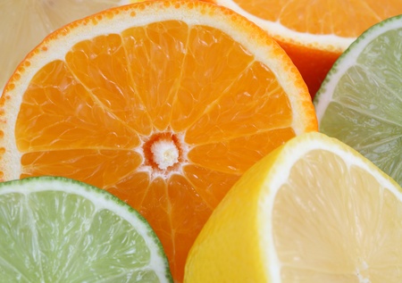 Oranges, lemons, limes, citrus fruits as a backgroundの写真素材