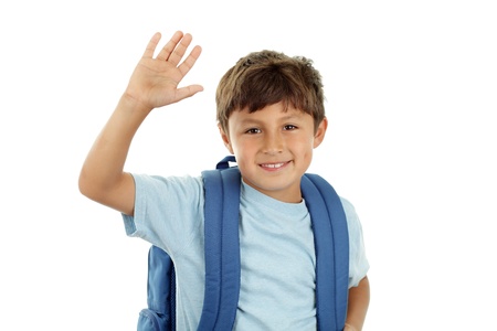 A young boy returns to school after the holidays in a cheerful mood - with his backpack