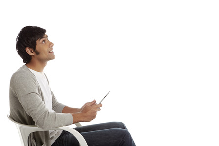 Cheerful man using a digital tablet