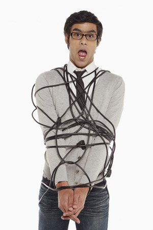 Man wrapped in a tangled cableの写真素材