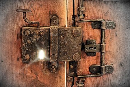 very old locker on medieval Cathedral main doorの写真素材