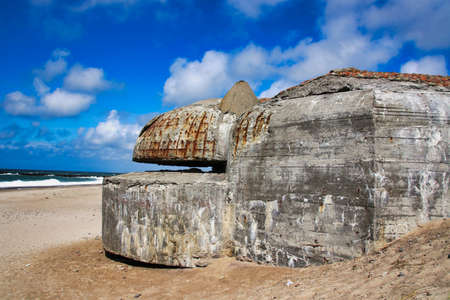 Old concrete bunkers from WWII line the beaches on the west coast of Denmark. The bunkers are part of The Atlantic Wallの写真素材