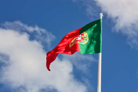 Portuguese flag isolated on sky background. close up waving flag of Portugal. flag symbols of Portugal.の写真素材