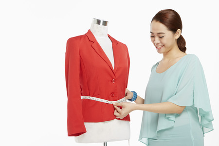 Woman taking measurementsの写真素材