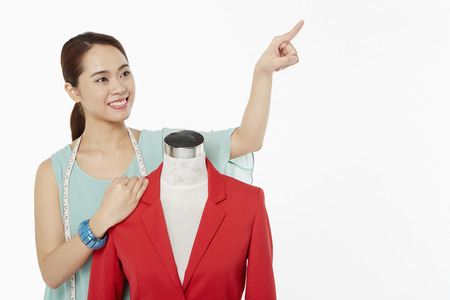 Woman pointing to the leftの写真素材