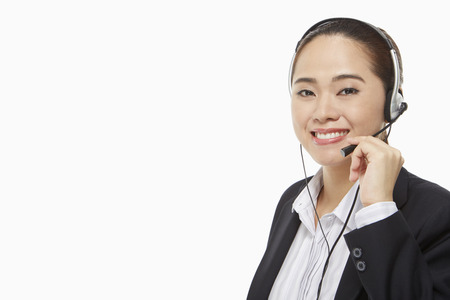Smiling businesswoman with headsetの写真素材
