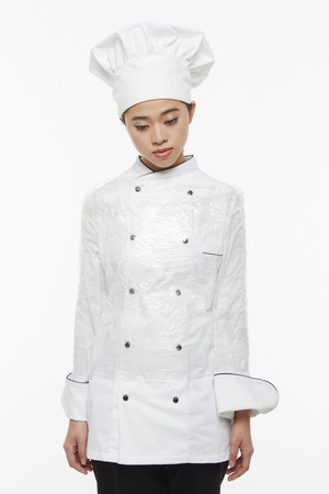 Female chef tied up with a cling wrapの写真素材