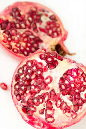 Pomegranates, sliced, pithy fruit, pomegranate seeds,のeditorial素材