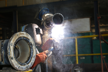 pipe and support are seam by technicain weldingの写真素材