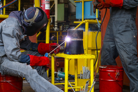 welder man are welding seam reduce pipeの写真素材