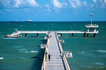 sea pier on sea background with ships