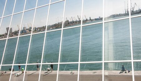 Seaport Reflection in glass wall of a modern buildingの写真素材