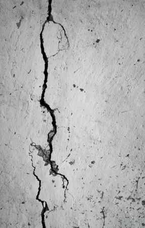 old plastered wall with a crack in itの写真素材