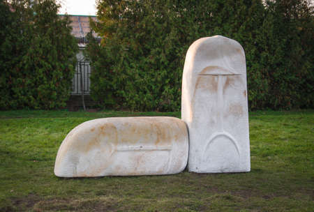 Pryluky, Ukraine - 09/14/2019: Stone sculpture on green grassのeditorial素材