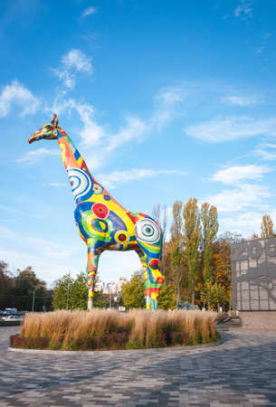 Kyiv, Ukraine - 10/21/2021: Kyiv Zoo. Sculpture of a colorful giraffe at the entrance to the zoo. Quality image for your projectのeditorial素材