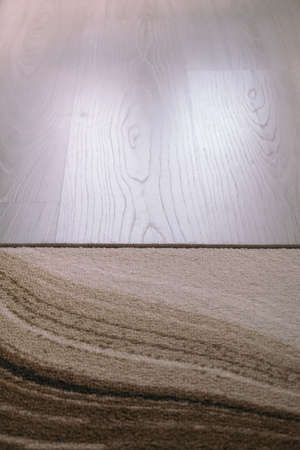 A rug of neutral colors on a white laminate background. Space for inscription. Quality image for your projectの写真素材